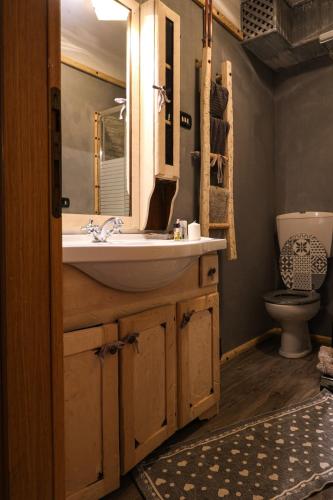 a bathroom with a sink and a toilet at Il Nido in Sestola