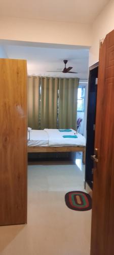 a bedroom with a bunk bed and a window at Eve Resort in Patnem
