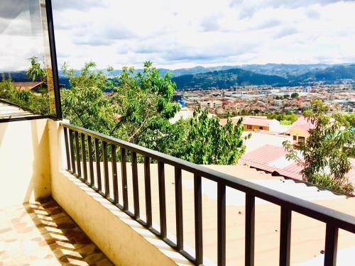 a balcony with a view of a city at View n Wide/Green Place in Cuenca