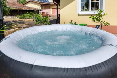 a large circular pool of water in a backyard at Ferienwohnung Alexandra in Rheinfelden