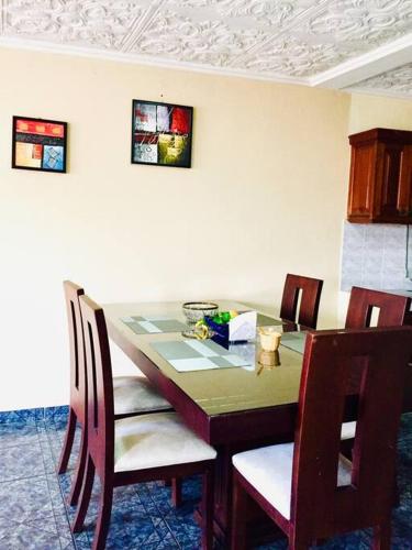 a dining room table with chairs and a table and a table and chairsktop at ABNorth4B Family in Cuenca