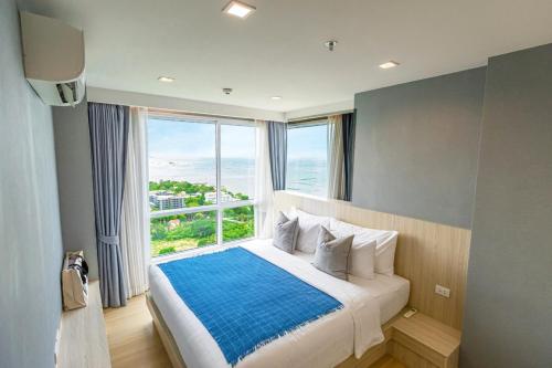 Llit o llits en una habitació de Yuu Residence
