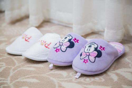 a pair of shoes with a mickey mouse on them at Marco Polo Xiamen in Xiamen