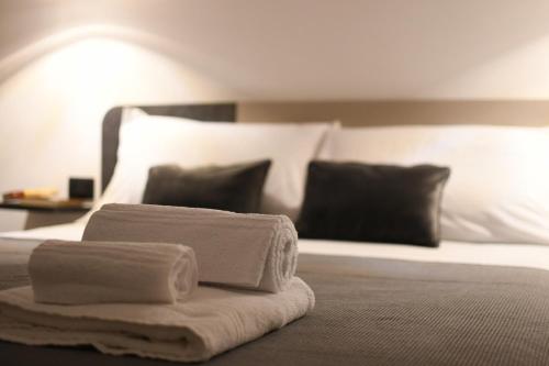 Una cama o camas en una habitación de Amaranto Guesthouse