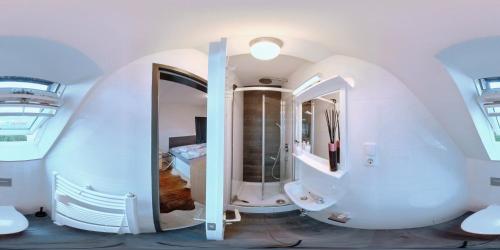 a bathroom with a circular sink and a mirror at Eagles Nest in Berlin