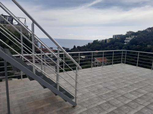 a balcony with a view of the ocean at Nino Lux Apartments Ulcinj in Ulcinj