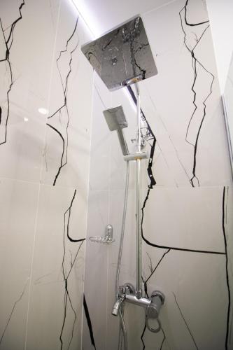 a bathroom with a broken wall with a sink at HOTEL GLAMOUR IMPERIAL in Buzău