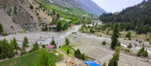 an aerial view of a river in a valley at Rakaposhi Amin Hotel & Restaurant Pissan Hunza Nagar Gilgit Baltistan in Gilgit