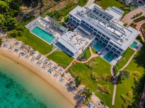an aerial view of a building on the beach at Vathi Cove Luxury Resort & Spa in Chrysi Ammoudia