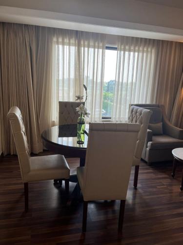 a living room with a table and chairs at Hotel Home In By Amrik Sukhdev in Sonīpat