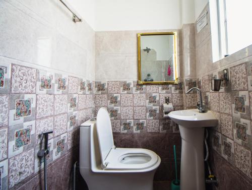 a bathroom with a toilet and a sink at Season homestay in Kathmandu