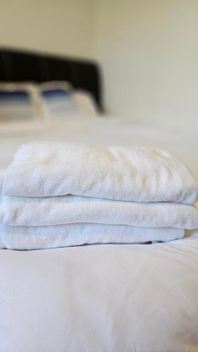 Postel nebo postele na pokoji v ubytování 15°C Lodge Kundasang