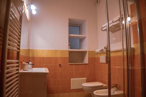 a bathroom with a toilet and a sink at Mare Sole in San Teodoro