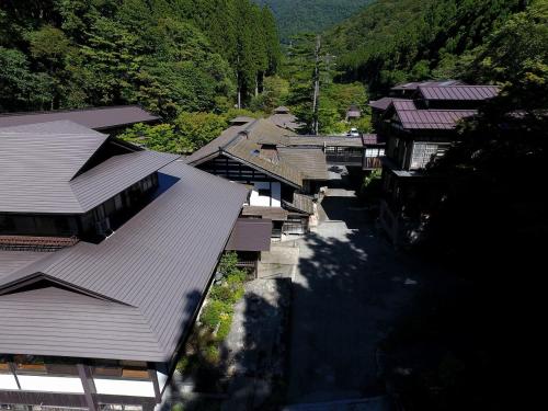 an overhead view of a village with houses and trees at Houshi Onsen Chojukan in Minakami