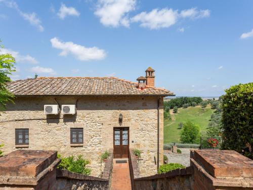 an external view of a stone building with a door at Lavish Holiday Home in Volterra with Pool in Volterra