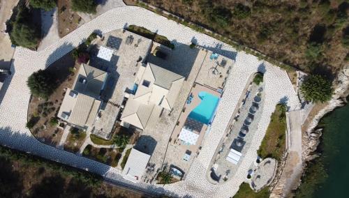 an overhead view of a building with a pool at Iris Villas in Spárton