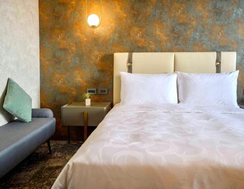 Cama o camas de una habitación en Tenz Go Hotel