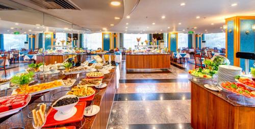 a buffet line with many plates of food at Bera Konya Hotel in Konya