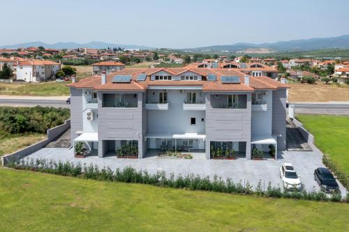 an aerial view of a house with a yard at Calives Premium Stay in Kalivia Poligirou