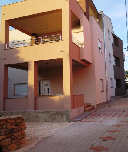 a house in the middle of a street at Apartment Stipan in Bibinje