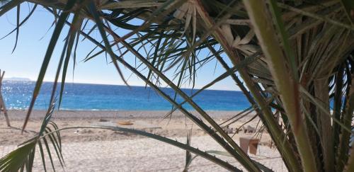 a view of a beach with the ocean in the background at Villa Ermis in Dhërmi