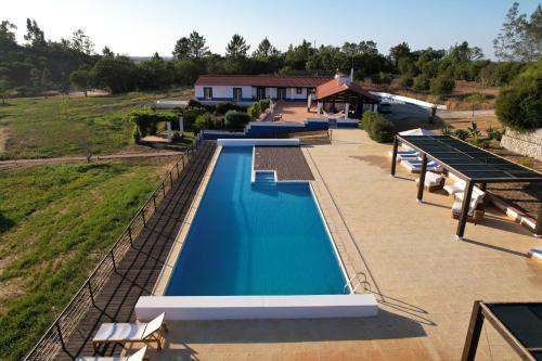 an overhead view of a swimming pool at a house at Vale da Cassiopeia in Cercal
