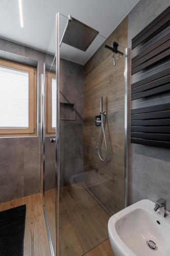 a bathroom with a shower and a sink at Stella Del Nord - Livigno Centro in Livigno