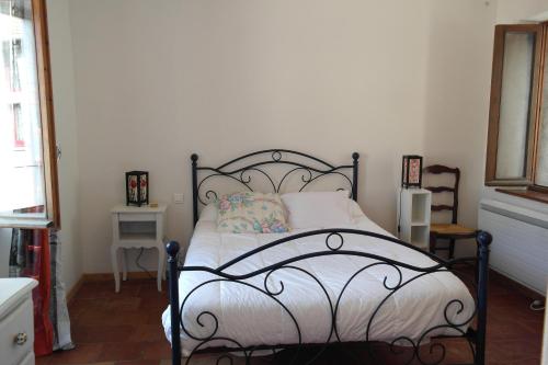 Postel nebo postele na pokoji v ubytování Maison dans Village médiéval