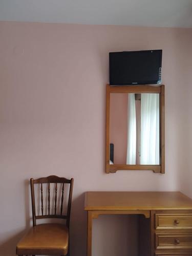TV a/nebo společenská místnost v ubytování Hostal La Parrilla