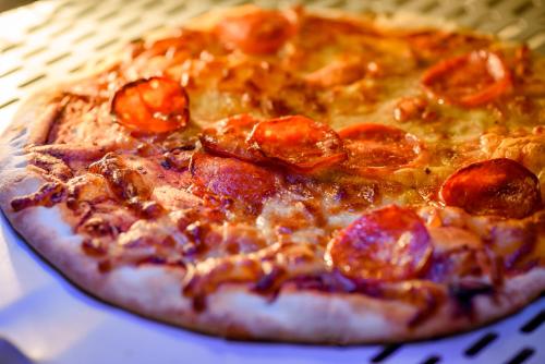 a pepperoni pizza sitting on top of a box at ibis Nottingham Centre in Nottingham