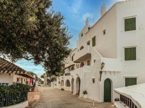 a street in a town with white buildings at Authentic apartment in Binibeca Vell with private terrace in Binibeca