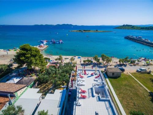 an aerial view of a beach and the water at Modern apartment right on the Janice beach in Pakostane centre 50 m away in Pakoštane