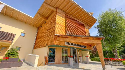 a building with a sign that reads bad beer brewery at Blu Hotel Natura & Spa - Adults Only in Folgaria