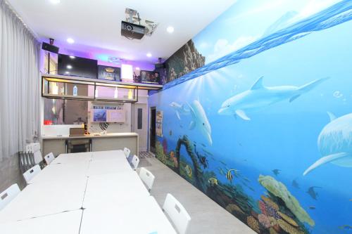 a room with a large aquarium on the wall at Sea Keelung in Keelung