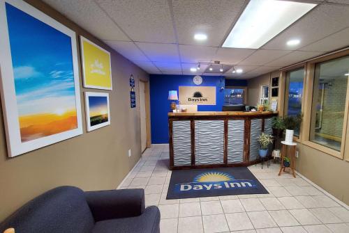 a waiting room at a doctors office with a daylin counter at Days Inn by Wyndham Monett in Monett
