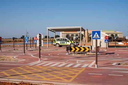 a parking lot with a car at a gas station at Vila Gale Nep Kids in Beja