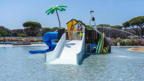 a water park with a slide in the water at Camping Village Roma Capitol in Ostia Antica