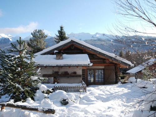 a log cabin with snow on the ground at Typical Cottage in Bellamonte Italy with bubble bath in Bellamonte