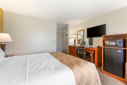 a hotel room with a bed and a desk at Quality Inn Dillon I-15 in Dillon