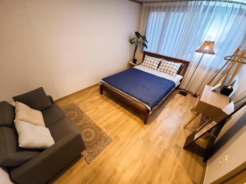 a living room with a bed and a couch at 3 Rooms for rent near Mapo-gu Office Station, Mapo-gu, Seoul in Seoul