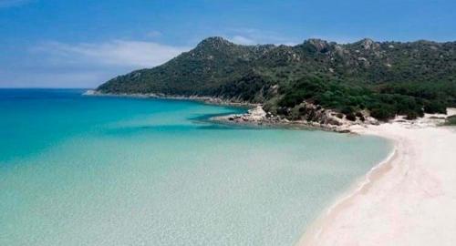 an aerial view of a beach with blue water at SU BISU Costa Rei R4991 terrace with sea view, 500m from the beach in Costa Rei