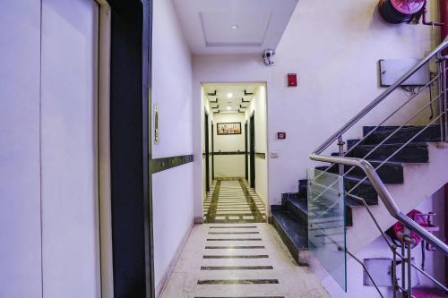 a hallway with stairs in a building at FabHotel Blue Moon Home Stay in New Delhi