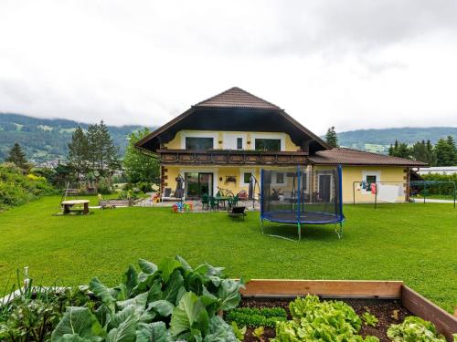a house with a playground in the yard at Spacious Apartment in Katschberg in Sankt Michael im Lungau