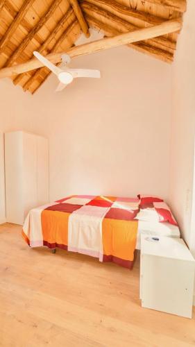 a bedroom with a bed and a table in it at Alojamiento Nevada in La Zubia