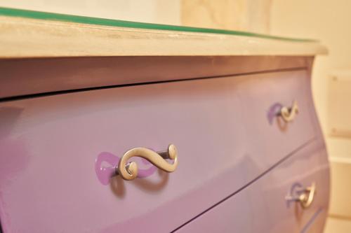 a close up of a dresser with a purple drawer at Villa Martin Hotel in Dolo
