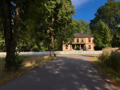 a house in the middle of a road at Frogner Hovedgård in Skien