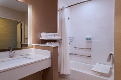 a bathroom with a sink and a shower at Fairfield Inn & Suites Houston Richmond in Richmond