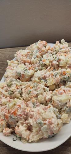 a pile of potato salad on a plate on a table at Ośrodek Wypoczynkowy Romed in Jastrzębia Góra