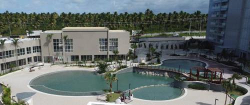 an overhead view of a swimming pool in a building at Suite - Aqualand Suites in Salinópolis