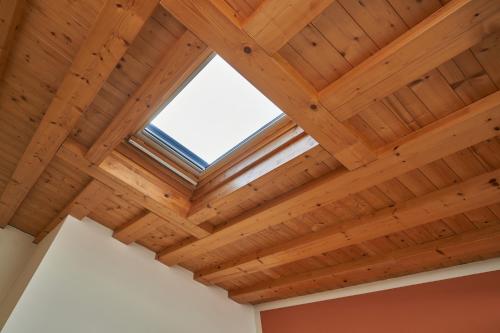 a wooden ceiling in a room with a window at Villa Martin Hotel in Dolo